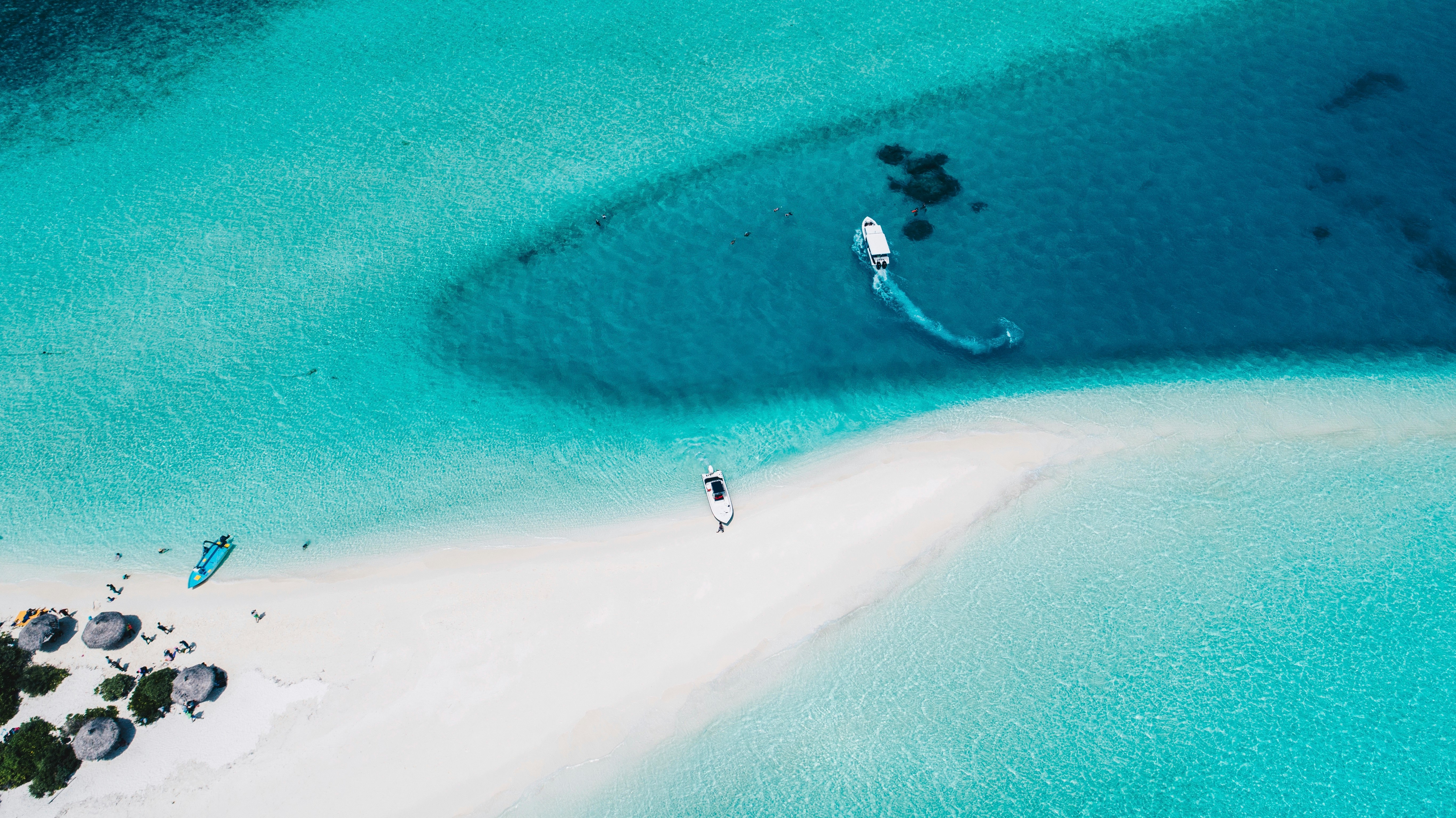 three motorized boats on sea aerial photography